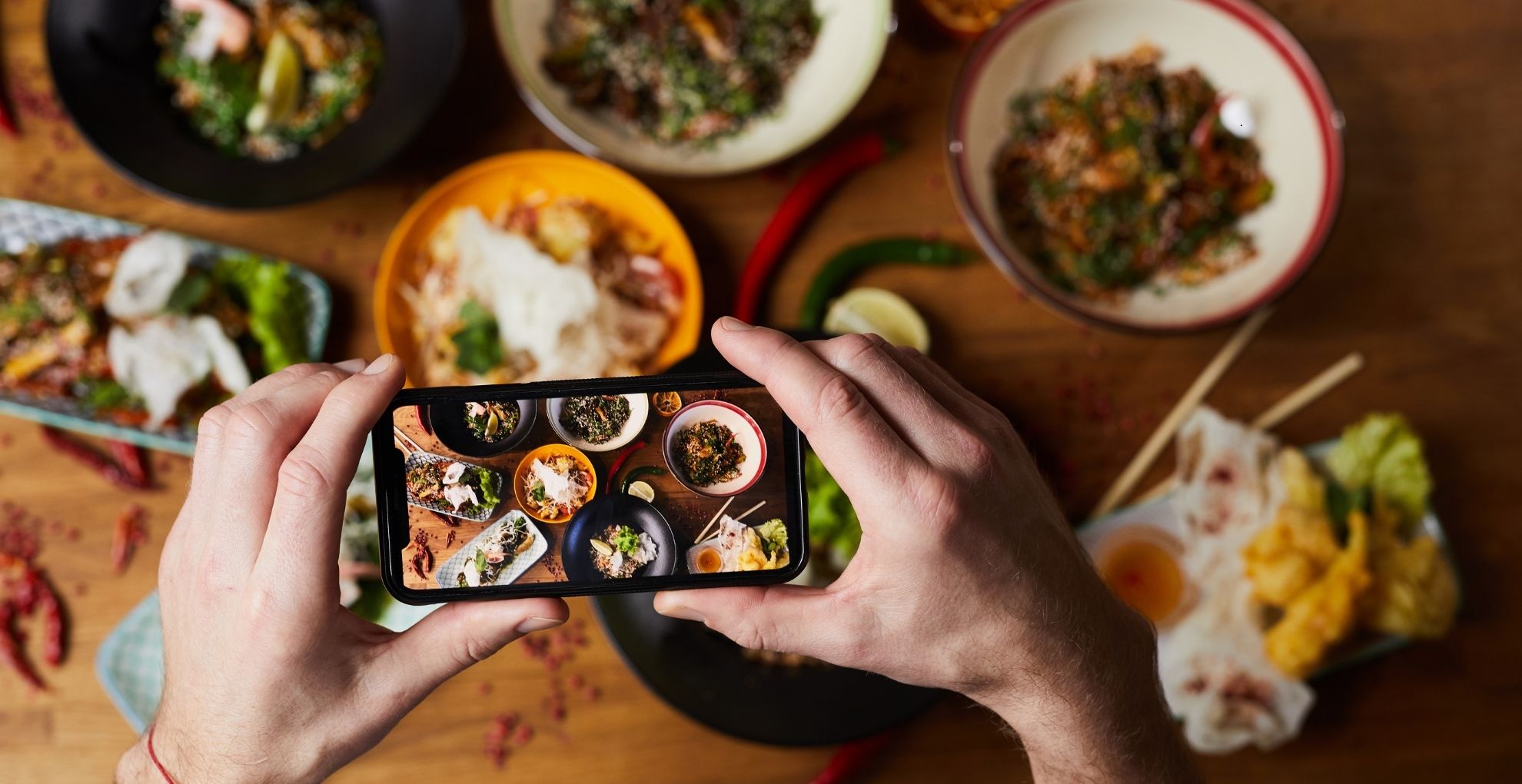customer taking a photo of meal for social media
